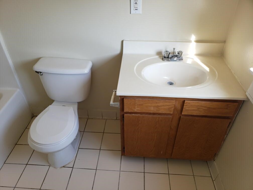 a bathroom with a toilet and a sink